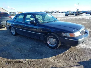 2002 Mercury Grand Marquis LS Premium z VIN 2MEFM75WX2X602511, wystawiony jako IAAI lot #41379754 z przebiegiem 164 582 mil mil oraz . Historia ofert i sprzedaży dostępna na DreamBid. Obrazek 1.