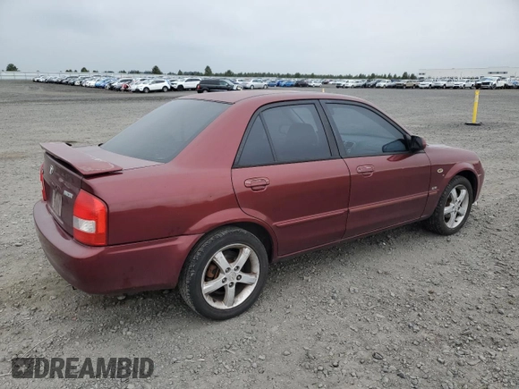 2002 Mazda Protege DX z VIN JM1BJ225320636991, wystawiony jako Copart lot #57915265 z przebiegiem 123 371 mil mil oraz Szkoda całkowita • Salvage title. Historia ofert i sprzedaży dostępna na DreamBid. Obrazek 3.