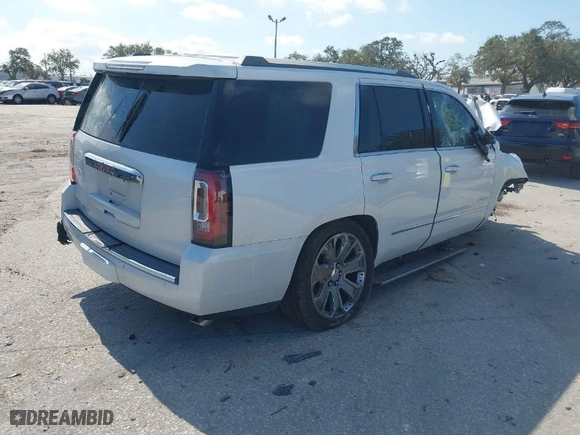 2016 GMC Yukon Denali with VIN 1GKS1CKJ9GR294828, listed as a IAAI auction lot 41497770 with 128,814 mi miles. Bid and sale history available at carsss.com. Image 4.