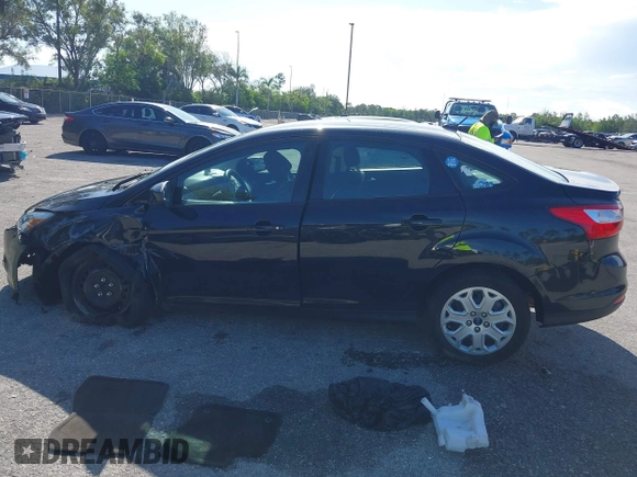 2012 Ford Focus SE with VIN 1FAHP3F22CL150631, listed as a IAAI auction lot 42594823 with 49,456 mi miles and . Bid and sale history available at DreamBid. Image 15.