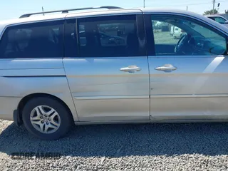 2006 Honda Odyssey EX-L with VIN 5FNRL38726B424923, listed as a IAAI auction lot 42099212 with 171,749 mi miles. Bid and sale history available at carsss.com. Image 6.