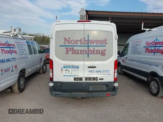 2015 Ford Transit Cargo with VIN 1FTNE2CM7FKA78466, listed as a IAAI auction lot 42074455 with 214,797 mi miles and . Bid and sale history available at carsss.com. Image 16.
