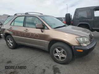 1999 Lexus RX 300 with VIN JT6HF10U1X0071946, listed as a Copart auction lot 53566055 with 133,138 mi miles and Salvage Title. Bid and sale history available at DreamBid. Image 4.