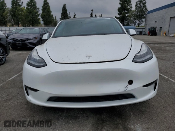 2022 Tesla Model Y Long Range z VIN 7SAYGDEE5NF352075, wystawiony jako Copart lot #50799895 z przebiegiem 11 597 mil mil oraz Szkoda całkowita • Salvage title. Historia ofert i sprzedaży dostępna na DreamBid. Obrazek 5.
