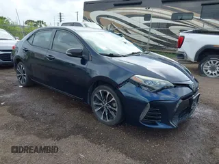 2017 Toyota Corolla L z VIN 5YFBURHE5HP685616, wystawiony jako IAAI lot #42388072 z przebiegiem 144 356 mil mil oraz . Historia ofert i sprzedaży dostępna na DreamBid. Obrazek 1.