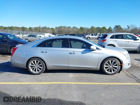 2013 Cadillac XTS Premium z VIN 2G61S5S35D9209252, wystawiony jako IAAI lot #41275066 z przebiegiem 132 311 mil mil oraz . Historia ofert i sprzedaży dostępna na DreamBid. Obrazek 14.