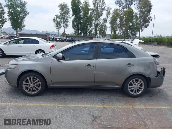 2012 Kia Forte EX with VIN KNAFU4A2XC5560585, listed as a IAAI auction lot 42121133 with 151,079 mi miles. Bid and sale history available at carsss.com. Image 14.