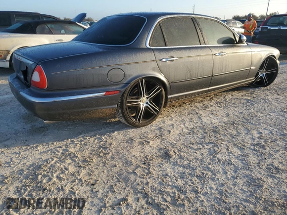 2004 Jaguar XJ with VIN SAJEA74C24SG09038, listed as a Copart auction lot 77015544 with Not Provided miles and Salvage Title. Bid and sale history available at DreamBid. Image 3.