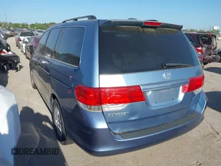 2009 Honda Odyssey EX-L with VIN 5FNRL38759B001130, listed as a IAAI auction lot 42004710 with 142,126 mi miles and . Bid and sale history available at DreamBid. Image 3.