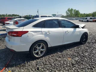 2016 Ford Focus Titanium z VIN 1FADP3J25GL201003, wystawiony jako Copart lot #53799745 z przebiegiem 194 055 mil mil oraz Szkoda całkowita • Salvage title. Historia ofert i sprzedaży dostępna na DreamBid. Obrazek 3.