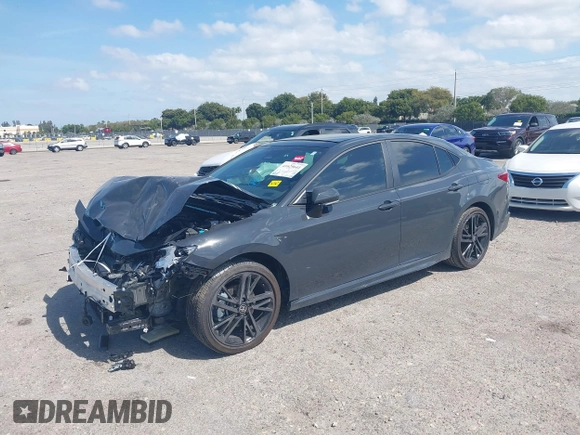2025 Toyota Camry LE with VIN 4T1DAACK5SU076886, listed as a IAAI auction lot 41629641 with 9,919 mi miles and . Bid and sale history available at DreamBid. Image 2.