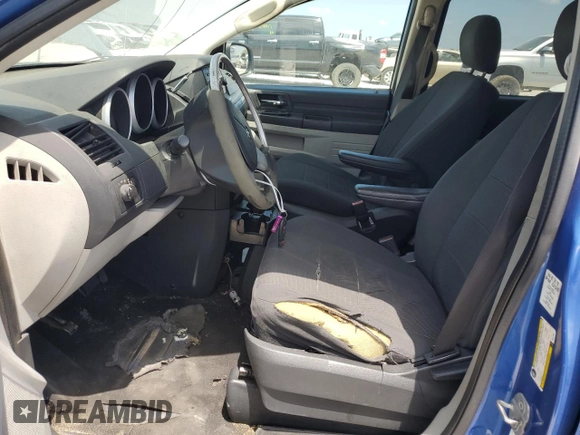 2008 Dodge Grand Caravan SE with VIN 2D8HN44H08R677094, listed as a Copart auction lot 66573804 with 210,318 mi miles and Clean Title. Bid and sale history available at DreamBid. Image 7.