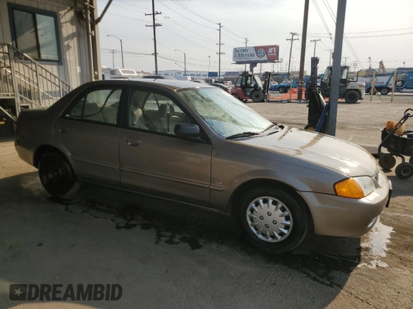 1999 Mazda Protege DX z VIN JM1BJ2223X0137153, wystawiony jako Copart lot #87899735 z przebiegiem 154 209 mil mil oraz Szkoda całkowita • Salvage title. Historia ofert i sprzedaży dostępna na DreamBid. Obrazek 4.