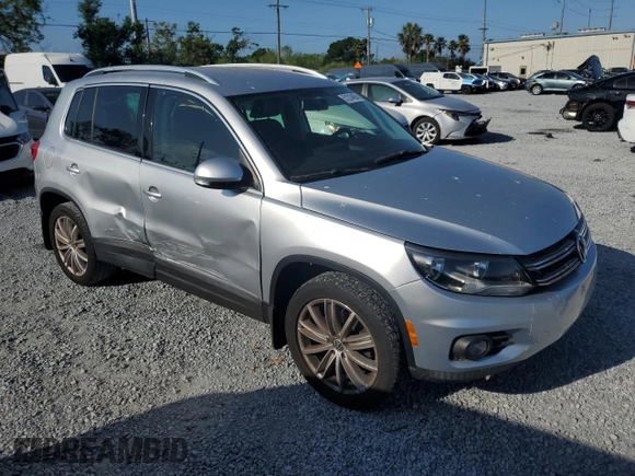 2012 Volkswagen Tiguan SE with VIN WVGAV7AX9CW607599, listed as a Copart auction lot 51214455 with 131,109 mi miles and Salvage Title. Bid and sale history available at DreamBid. Image 4.