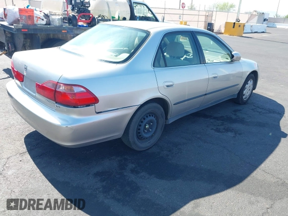 1999 Honda Accord LX with VIN JHMCG6650XC011621, listed as a IAAI auction lot 42401527 with 243,227 mi miles and . Bid and sale history available at DreamBid. Image 4.