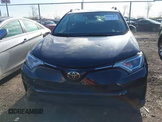 2018 Toyota RAV4 LE with VIN 2T3BFREV8JW706999, listed as a IAAI auction lot 41863485 with 115,589 mi miles. Bid and sale history available at carsss.com. Image 12.