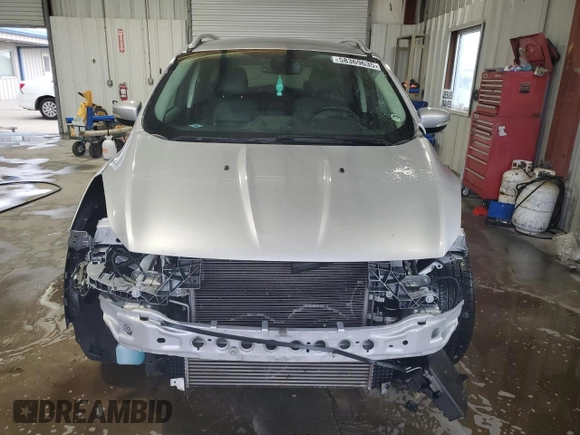 2014 Ford Escape Titanium с VIN 1FMCU0J98EUA35069, выставлен на аукционе Copart как лот 58369635 с пробегом 92 323 миль миль и Списание • Salvage title. История ставок и продаж доступна на DreamBid. Изображение 5.
