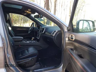 2016 Jeep Grand Cherokee Limited 75th Anniversary with VIN 1C4RJFBT9GC400873, listed as a IAAI auction lot 41834112 with 110,457 mi miles and . Bid and sale history available at DreamBid. Image 5.