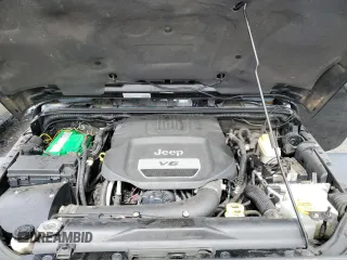 2014 Jeep Wrangler Sahara with VIN 1C4AJWBG0EL306703, listed as a Copart auction lot 51450215 with 115,932 mi miles and Salvage Title. Bid and sale history available at DreamBid. Image 12.
