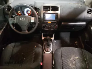 2014 Scion xD with VIN JTKKUPB48E1046627, listed as a Copart auction lot 61498995 with 63,452 mi miles and Salvage title. Bid and sale history available at DreamBid. Image 8.