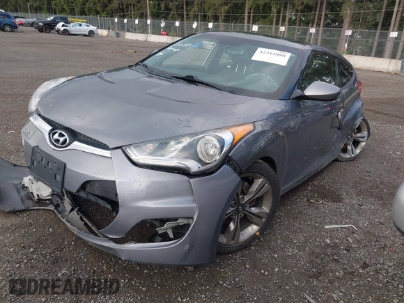 2012 Hyundai Veloster w/Gray Int z VIN KMHTC6AD9CU069416, wystawiony jako IAAI lot #42314080 z przebiegiem Nie podano mil oraz . Historia ofert i sprzedaży dostępna na DreamBid. Obrazek 2.