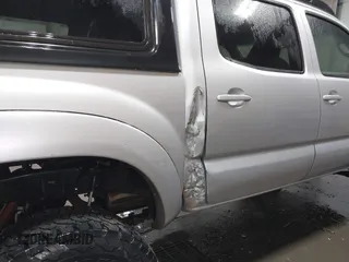 2011 Toyota Tacoma with VIN 3TMLU4EN9BM070836, listed as a IAAI auction lot 41668595 with 89,879 mi miles and . Bid and sale history available at DreamBid. Image 6.
