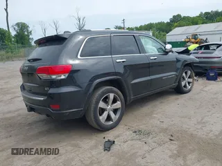 2015 Jeep Grand Cherokee Overland z VIN 1C4RJFCG3FC753772, wystawiony jako IAAI lot #42357411 z przebiegiem 130 970 mil mil oraz . Historia ofert i sprzedaży dostępna na DreamBid. Obrazek 4.