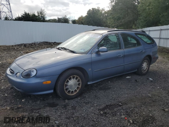 1999 Ford Taurus SE z VIN 1FAFP58S2XA261374, wystawiony jako Copart lot #74180494 z przebiegiem 193 416 mil mil oraz Szkody całkowita. Historia ofert i sprzedaży dostępna na DreamBid. Obrazek 1.