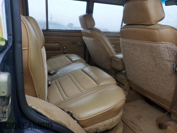 1987 Jeep Grand Wagoneer with VIN 1JCNJ15U7HT006097, listed as a Copart auction lot 89191925 with 119,168 mi miles and Salvage title. Bid and sale history available at DreamBid. Image 10.
