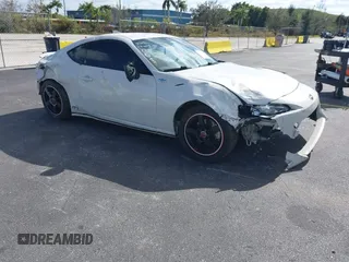 2015 Scion FR-S z VIN JF1ZNAA17F9712991, wystawiony jako IAAI lot #41308275 z przebiegiem 56 996 mil mil oraz . Historia ofert i sprzedaży dostępna na DreamBid. Obrazek 1.