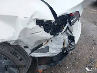 2023 Tesla Model 3 z VIN 5YJ3E1EA0PF511158, wystawiony jako IAAI lot #42210455 z przebiegiem 22 291 mil mil oraz . Historia ofert i sprzedaży dostępna na DreamBid. Obrazek 6.