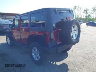 2011 Jeep Wrangler Unlimited Sport with VIN 1J4BA3H18BL598323, listed as a IAAI auction lot 41958043 with 154,354 mi miles. Bid and sale history available at carsss.com. Image 3.