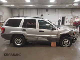 2004 Jeep Grand Cherokee Laredo with VIN 1J4GW48S44C321869, listed as a IAAI auction lot 41822099 with 181,663 mi miles. Bid and sale history available at carsss.com. Image 13.