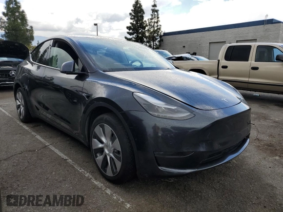 2024 Tesla Model Y with VIN 7SAYGDED1RF052031, listed as a Copart auction lot 48507865 with 5,365 mi miles and Salvage title. Bid and sale history available at DreamBid. Image 4.