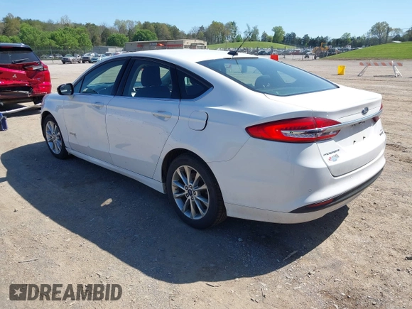 2017 Ford Fusion Hybrid SE z VIN 3FA6P0LU8HR396572, wystawiony jako IAAI lot #41997684 z przebiegiem 272 803 mil mil oraz . Historia ofert i sprzedaży dostępna na DreamBid. Obrazek 3.
