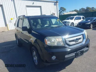 2009 Honda Pilot EX-L with VIN 5FNYF48599B023705, listed as a IAAI auction lot 41904286 with 142,140 mi miles. Bid and sale history available at carsss.com. Image 1.