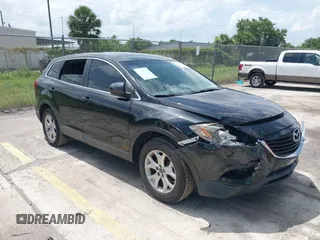 2014 Mazda CX-9 Touring z VIN JM3TB2CA5E0429835, wystawiony jako IAAI lot #42439258 z przebiegiem 110 914 mil mil oraz . Historia ofert i sprzedaży dostępna na DreamBid. Obrazek 1.