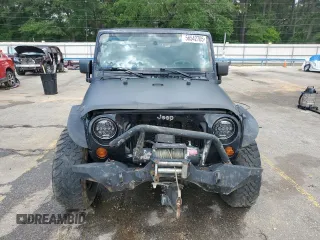 2009 Jeep Wrangler X with VIN 1J4FA24199L783458, listed as a Copart auction lot 56542705 with 236,840 mi miles and Salvage title. Bid and sale history available at DreamBid. Image 5.