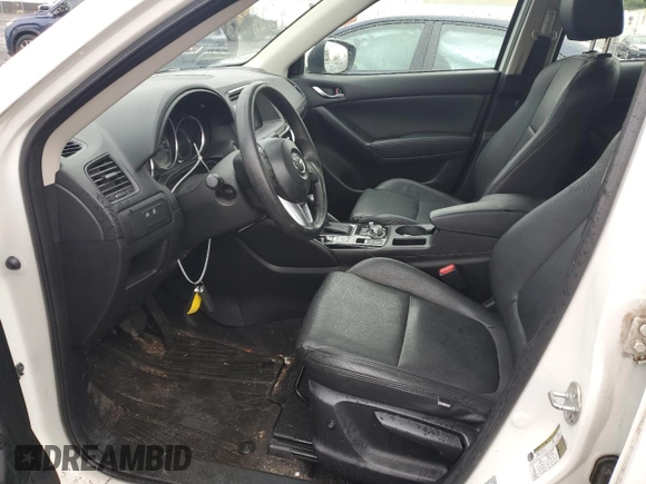 2016 Mazda CX-5 Sport z VIN JM3KE4BY2G0802376, wystawiony jako Copart lot #55976585 z przebiegiem 112 600 mil mil oraz Szkoda całkowita • Salvage title. Historia ofert i sprzedaży dostępna na DreamBid. Obrazek 7.
