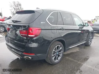 2018 BMW X5 xDrive40e iPerformance with VIN 5UXKT0C54J0V99573, listed as a IAAI auction lot 41490567 with 50,650 mi miles. Bid and sale history available at carsss.com. Image 4.
