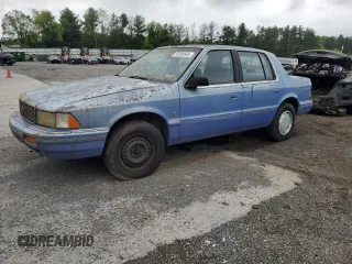 1991 Plymouth Acclaim z VIN 1P3XA4633MF523214, wystawiony jako Copart lot #55908665 z przebiegiem 90 332 mil mil oraz Tytuł czysty. Historia ofert i sprzedaży dostępna na DreamBid. Obrazek 1.