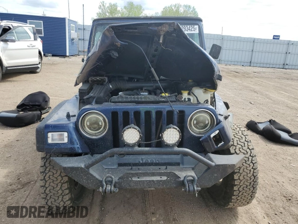 2002 Jeep Wrangler Sport z VIN 1J4FA49SX2P772609, wystawiony jako Copart lot #55893425 z przebiegiem 157 653 mil mil oraz Szkoda całkowita • Salvage title. Historia ofert i sprzedaży dostępna na DreamBid. Obrazek 5.