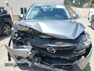 2014 Mazda CX-5 Sport with VIN JM3KE2BEXE0329303, listed as a IAAI auction lot 42556908 with 127,836 mi miles and . Bid and sale history available at DreamBid. Image 12.