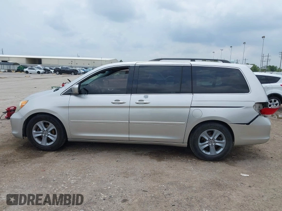 2009 Honda Odyssey Touring z VIN 5FNRL38979B052923, wystawiony jako IAAI lot #42427207 z przebiegiem 201 483 mil mil oraz . Historia ofert i sprzedaży dostępna na DreamBid. Obrazek 14.