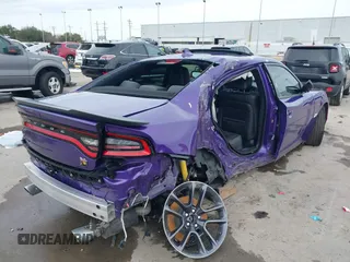 2023 Dodge Charger Scat Pack Widebody with VIN 2C3CDXGJ5PH699595, listed as a IAAI auction lot 41303894 with 1,828 mi miles and . Bid and sale history available at DreamBid. Image 4.