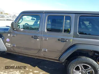 2019 Jeep Wrangler Unlimited Sport S with VIN 1C4HJXDG5KW505015, listed as a IAAI auction lot 41560088 with 54,193 mi miles and . Bid and sale history available at DreamBid. Image 14.