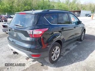 2017 Ford Escape SE with VIN 1FMCU9G91HUB56073, listed as a IAAI auction lot 42130463 with 94,275 mi miles and . Bid and sale history available at carsss.com. Image 4.