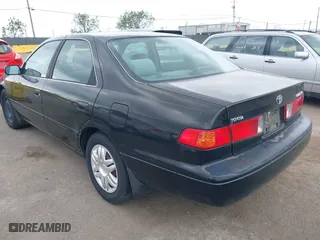 2000 Toyota Camry CE with VIN JT2BG22KXY0499280, listed as a IAAI auction lot 42075329 with 321,420 mi miles. Bid and sale history available at carsss.com. Image 3.