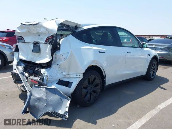 2024 Tesla Model Y with VIN 7SAYGDED8RF201955, listed as a IAAI auction lot 42700483 with 11,898 mi miles and . Bid and sale history available at DreamBid. Image 4.
