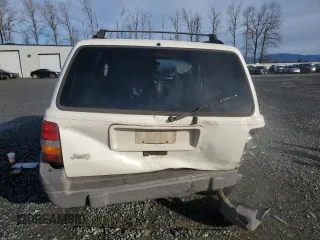 1996 Jeep Grand Cherokee Laredo with VIN 1J4EX58S3TC110154, listed as a Copart auction lot 46947805 with 268,507 mi miles and Salvage Title. Bid and sale history available at carsss.com. Image 6.